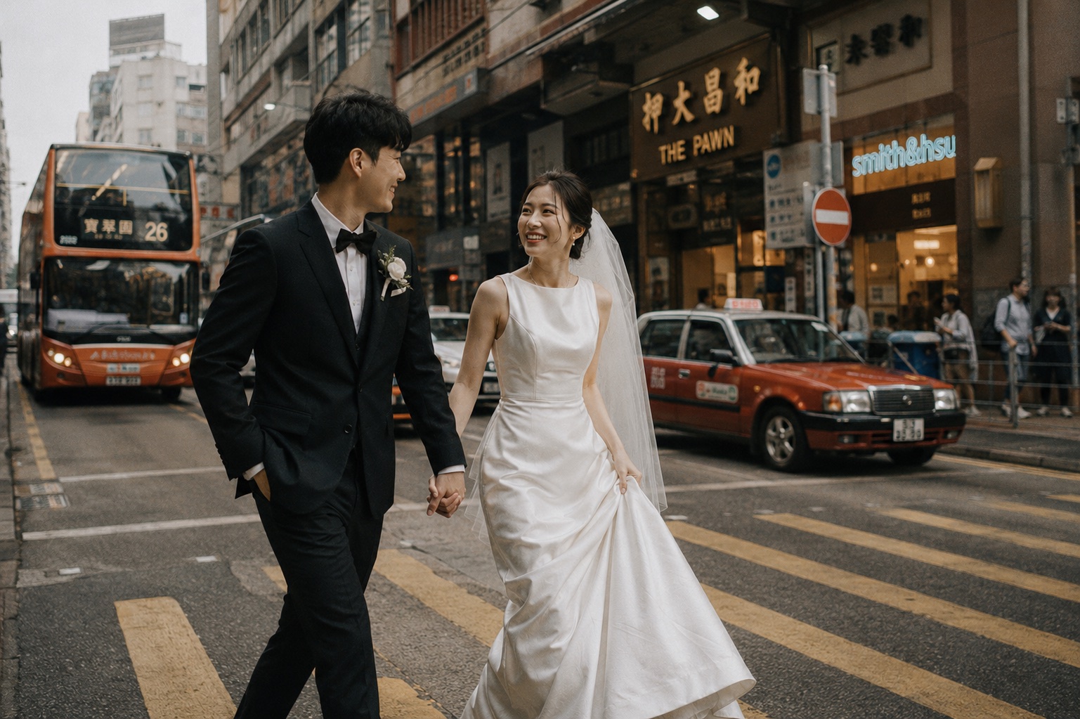 Suki and Adrian holding hands on a Hong Kong street beside a red taxi