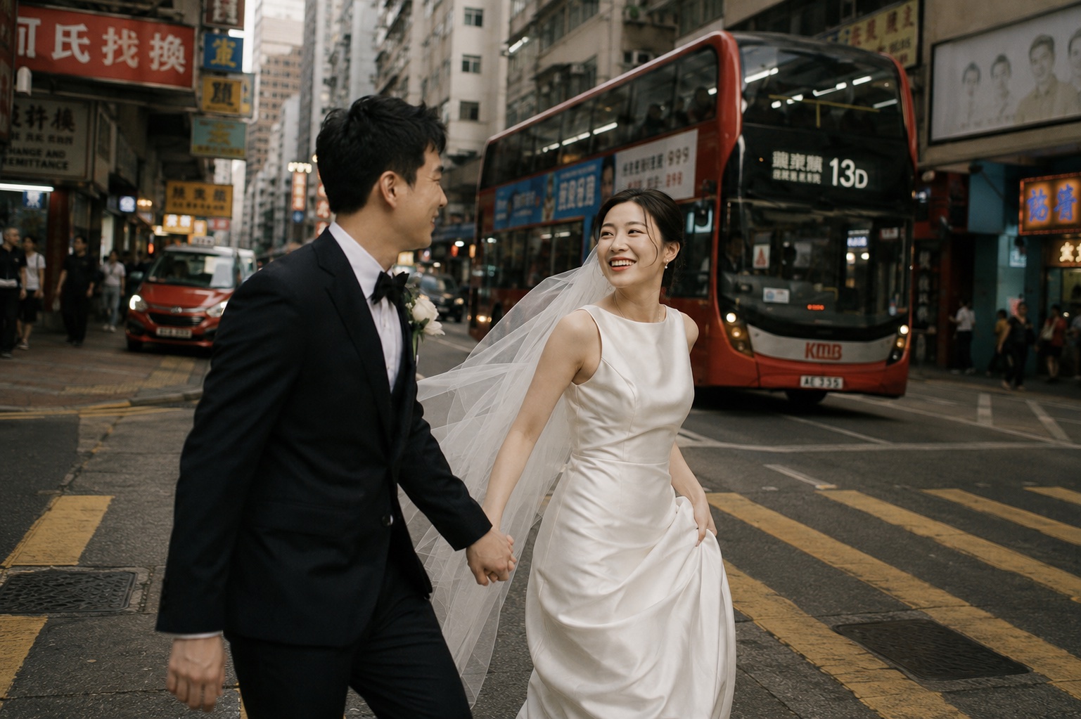 Suki and Adrian crossing a Hong Kong street together in wedding attire